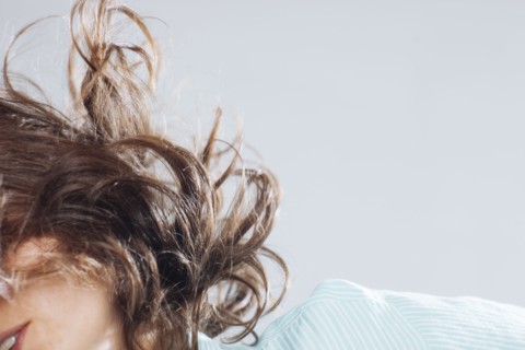 Caucasian woman tossing her hair