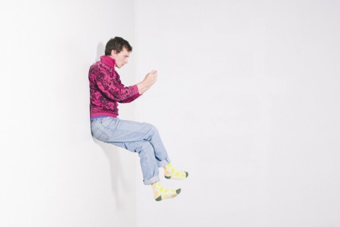 Caucasian man using cell phone in mid
