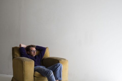 Caucasian man sitting in armchair