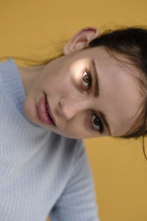 Close up of Caucasian woman tilting head