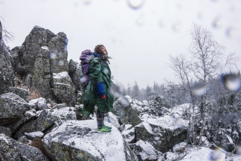 Caucasian hiker standing on rocky hillside