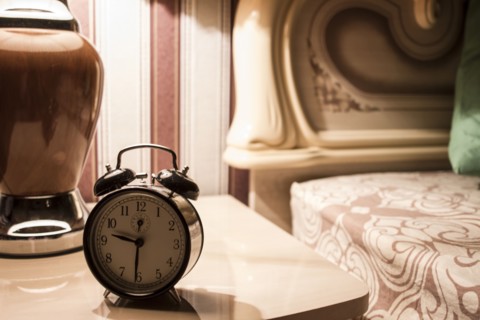 Alarm clock on bedside table
