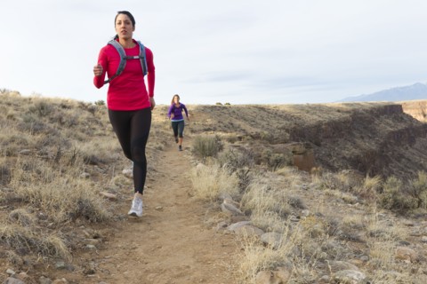 Hispanic runners training in remote area