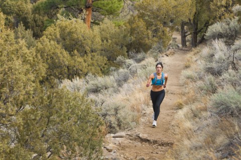 Hispanic runner training in remote area