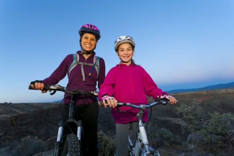 Sisters mountain biking together