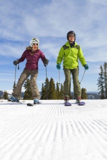 Caucasian couple skiing together