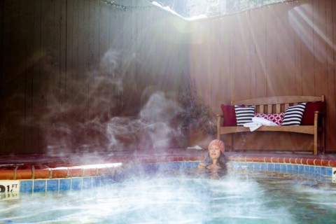 Woman relaxing in hot tub
