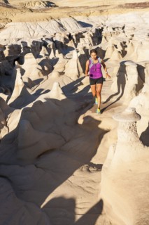 Native American woman running in desert