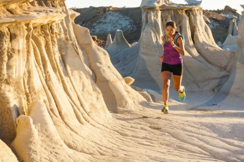 Native American woman running in desert