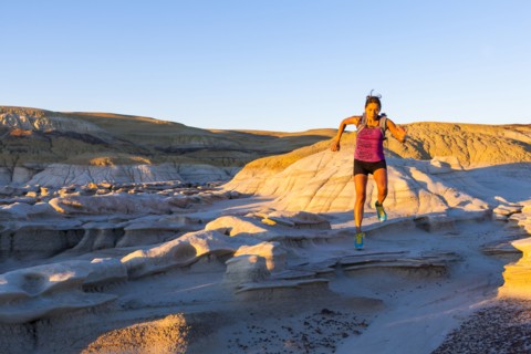 Native American woman running in desert