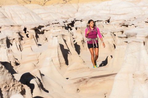 Native American woman hiking in desert