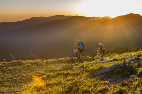 Caucasian couple mountain biking