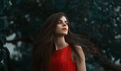 Caucasian woman spinning hair