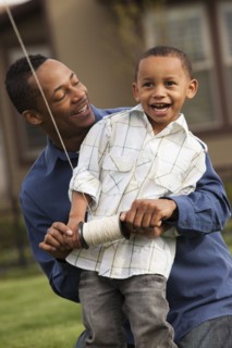 Father and son flying kite