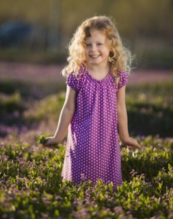 Caucasian girl picking flowers