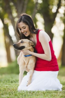 Caucasian woman petting dog