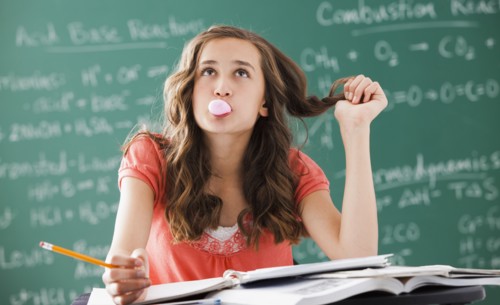 Caucasian teenager daydreaming in classroom