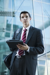 Caucasian businessman using digital tablet