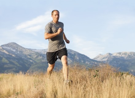 Caucasian man running in remote area