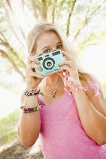 Caucasian woman taking photographs