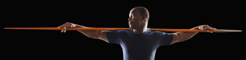 African American man holding track and field javelin
