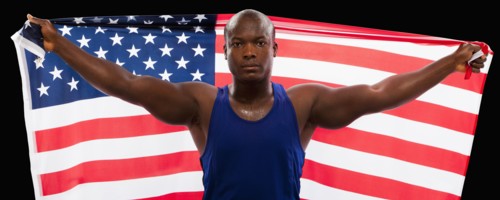 African American athlete holding American flag