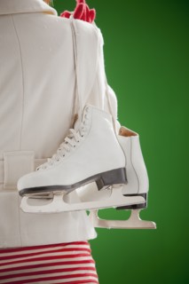 Mixed race woman carrying ice skates