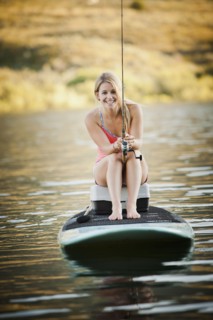 Caucasian woman fishing in lake