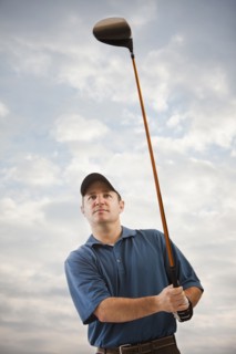 Caucasian golfer playing golf