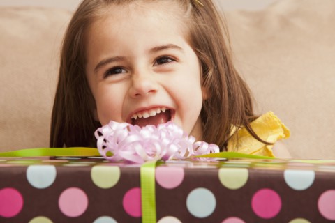 Caucasian girl holding gift