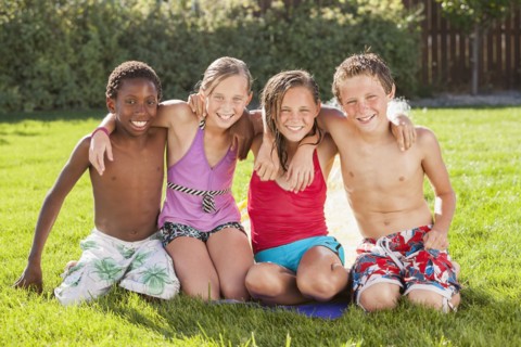 Friends hanging out together in yard