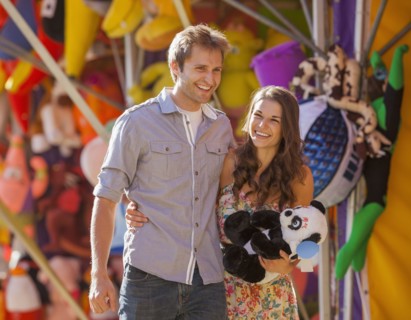 Caucasian couple enjoying carnival
