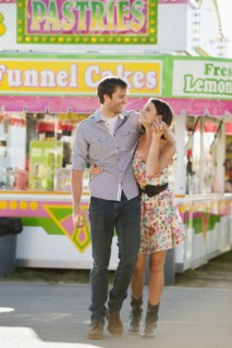 Caucasian couple enjoying carnival