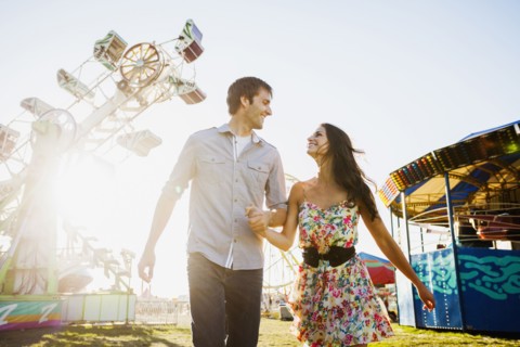 Caucasian couple enjoying carnival