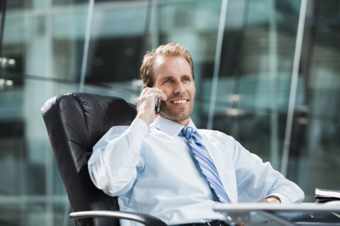 Caucasian businessman talking on cell phone