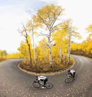 Caucasian cyclists on rural road