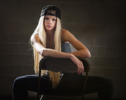 Caucasian woman sitting in folding chair