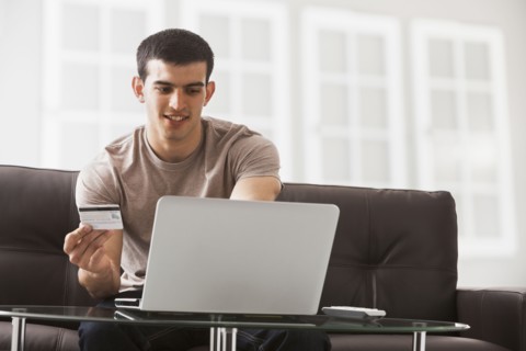 Hispanic man shopping online