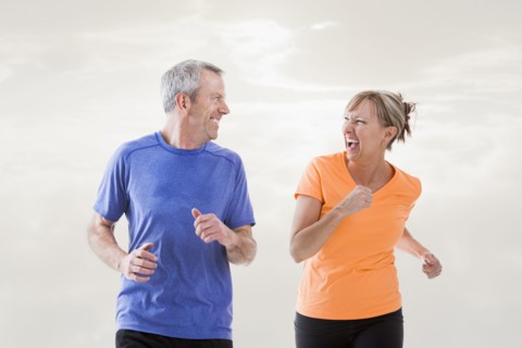 Caucasian couple jogging together