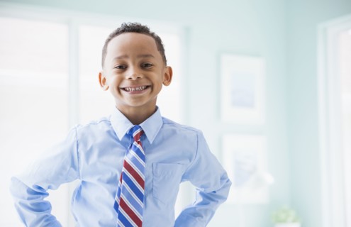 Mixed race boy wearing shirt and tie