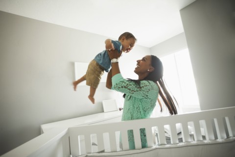 Mother playing with baby boy