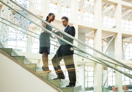 Business people talking on staircase