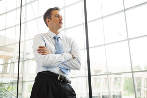 Caucasian businessman standing at window