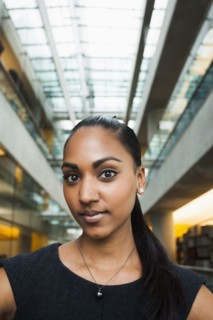 Indian businesswoman smiling in office