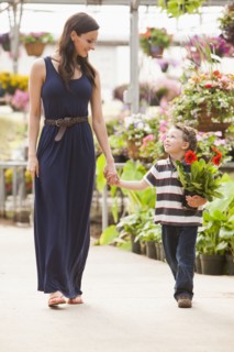 Caucasian mother and son shopping in nursery