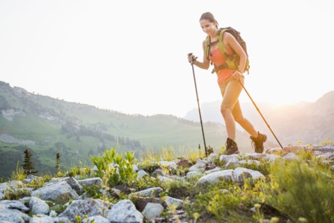 Caucasian woman hiking on rocky trail