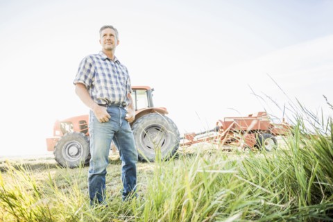 Caucasian farmer standing in field
