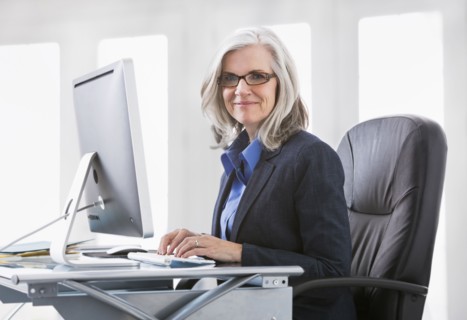 Portrait of confident Caucasian working at computer
