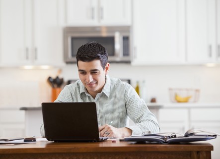 Hispanic businessman working at home