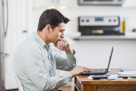 Hispanic businessman working at home